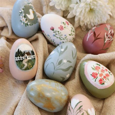 several painted eggs sitting on top of a cloth