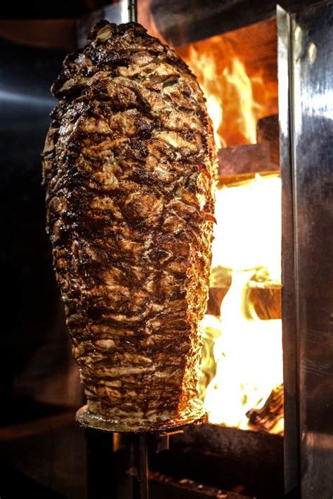 Charcoal Shawarma Meat. Closeup Of Chicken Meat Collected On A Vertical Skewer And Grilled On ...