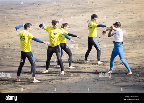 Surfing. Surfers and surf school on Las Canteras beach in Las Palmas, Gran Canaria, Canary ...