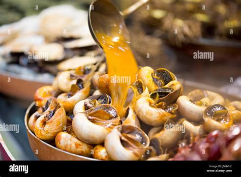 Bowl of cooked snail soup on Chinese street food market, Wangfujing Stock Photo: 150853838 - Alamy