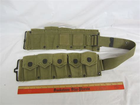 Green canvas military belt ammo pouches