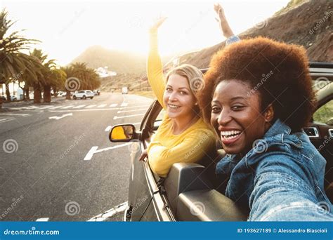 Young Happy Women Taking Selfie Doing Road Trip - Travel Girls Having Fun Driving in Trendy ...