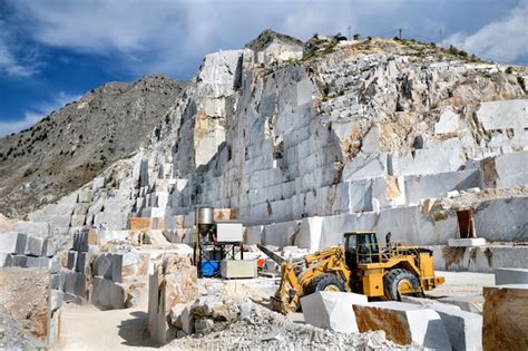 Premium Photo | Industrial machinery in an open cast marble quarry ...