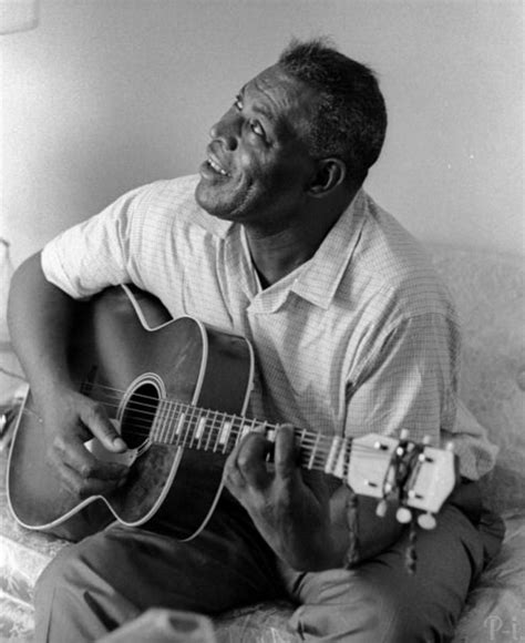 Howlin’ Wolf, posing with his guitar, during an interview for the ...