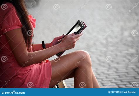 A Girl Sitting on a Bench and Reading a Book Stock Image - Image of ...