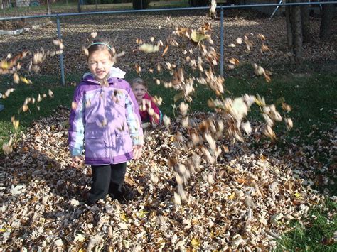 Precious girls: Jumping in the leaves!