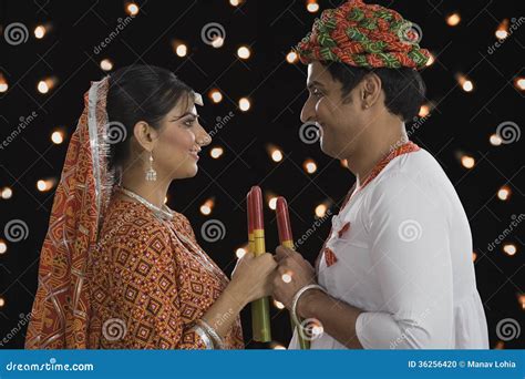 Couple Performing Dandiya Raas on Navratri Stock Photo - Image of bulb ...