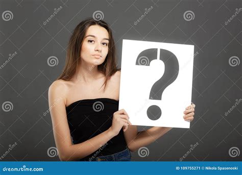 Brunette Girl Holding a Question Mark Sign Stock Image - Image of ...