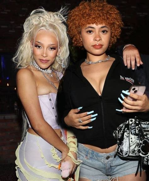 two women standing next to each other at a party