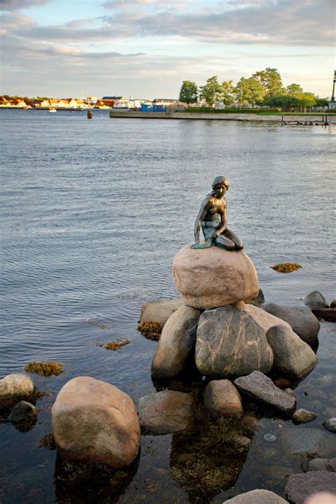 The Little Mermaid in Copenhagen, a bronze statue designed by Edvard Eriksen based on the story ...