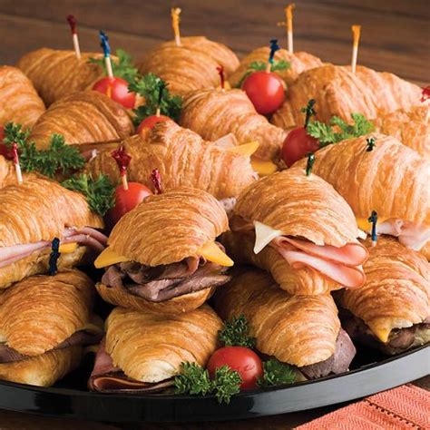 Snack-Lits: Mini croissant rolls are filled with smoked turkey breast, honey ham, roast beef and ...