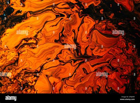 Background With Mixed Liquid Black And Orange Paints. Abstract Fluid Acrylic Painting ...