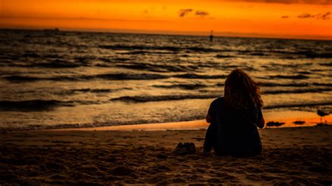 Girl Is Sitting On Beach Sand Watching Ocean Waves During Sunset HD Beach Wallpapers | HD ...