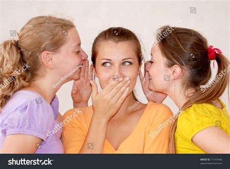 Friends Telling Secrets Over White Background Stock Photo 71147446 ...