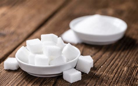 Premium Photo | Portion of white sugar in a bowl