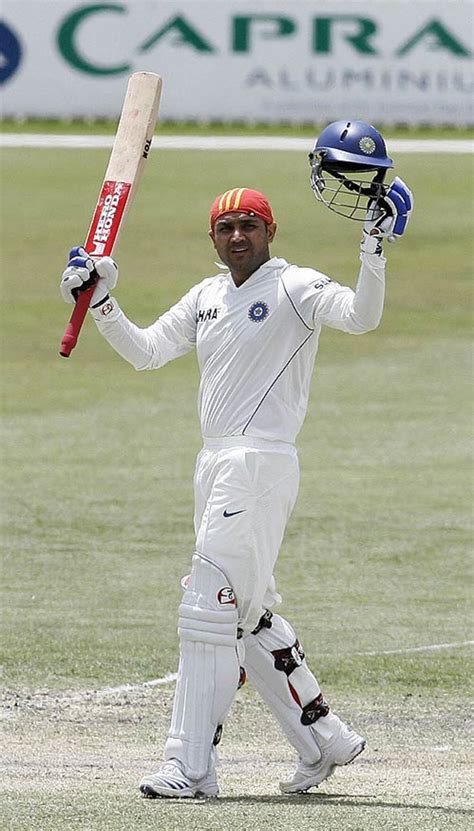 Virender Sehwag acknowledges the applause on reaching a century from 73 balls | ESPNcricinfo.com