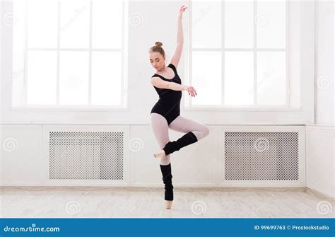 Beautiful Ballerina Stands in Ballet Pirouette Stock Image - Image of floor, elegance: 99699763