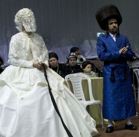 323E9F9C00000578-3495234-The_bride_holds_a_gartel_while_family_members ...