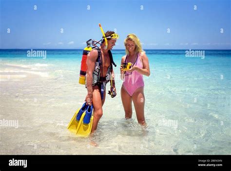 Couple scuba diving, Kuda Bandos, Kaafu Atoll, Republic of Maldives ...