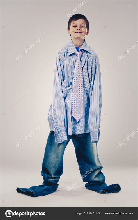 Funny boy wearing Dad's clothes Stock Photo by ©zdenkam 188471143