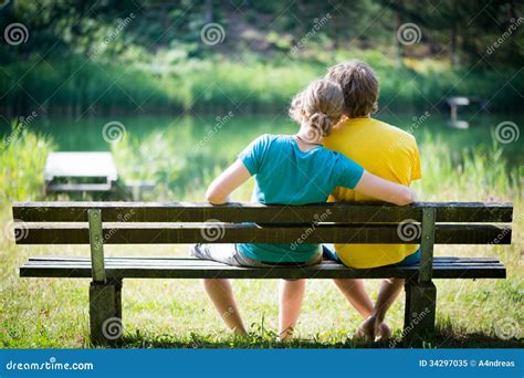 Lovely Young Couple Sitting on Bench Stock Image - Image of happy, love: 34297035