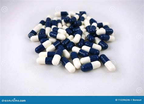 Blue and white capsules stock photo. Image of cure, blue - 112396246