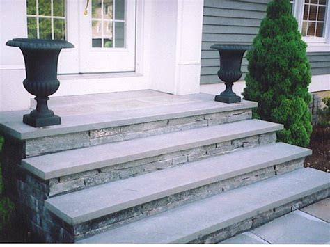 concrete stairs covered in stone veneer with bluestone treads | Front steps stone, Concrete ...