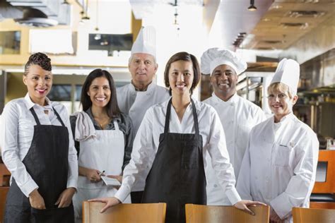 Hats For Kitchen Staff kitchen staff preparing dishes in restaurant stock photo kitchen ...