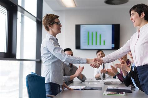 business womans handshake 12444058 Stock Photo at Vecteezy