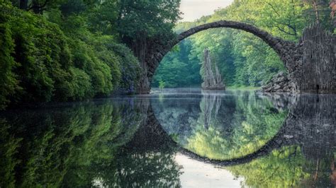 Arched Devil's Bridge (Rakotzbrucke) in summer, Kromlau, Germany ...