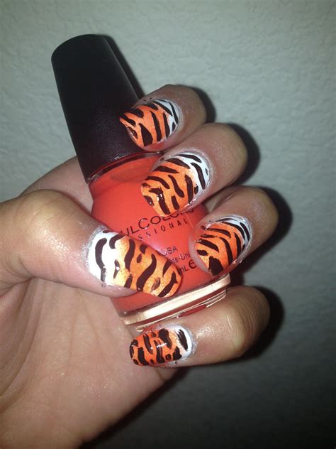 Tiger print nails! I wished my nails were this long. I did this myself but just on fake nails ...