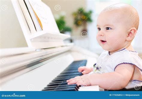 Baby Girl Playing the Piano Stock Image - Image of baby, learning: 77326853