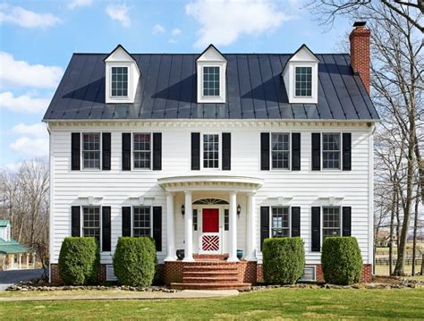 A traditional center hall colonial w/ white painted exterior and black metal roof | Colonial ...