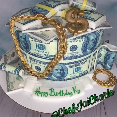 a birthday cake made to look like money with a gold chain and dollar ...