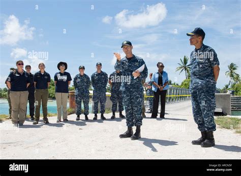 Adm. Cecil D. Haney, commander of U.S. Pacific Fleet, listens as Capt. Wallace Lovely, mission ...