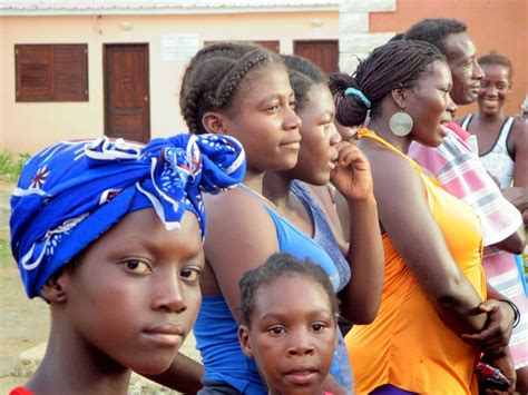 Local residents gather to watch traditional dancing outside the Igreja ...