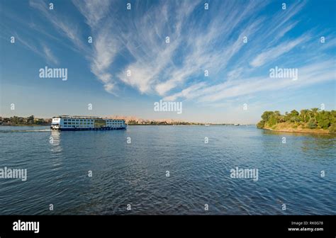 Large luxury traditional Egyptian river cruise boat sailing on the Nile ...