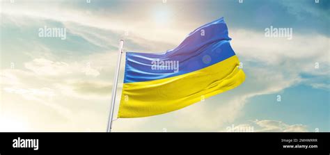 Ukraine national flag waving in beautiful sky Stock Photo - Alamy