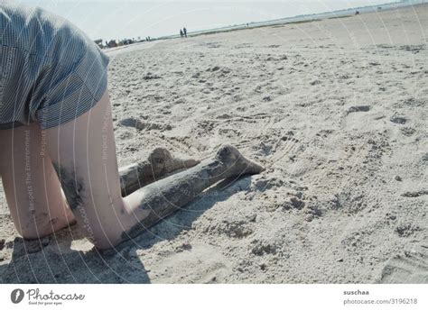 digging on the beach - a Royalty Free Stock Photo from Photocase