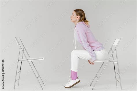 Woman Sitting On Chair Side View