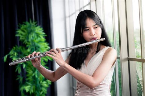 Flute Classical Instrument Profestional Player Playing Song. a Young and Elegant Asian Woman ...