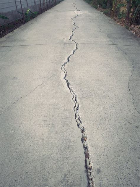 The Cement Road Cracked in a Long Line. Stock Image - Image of fissure ...