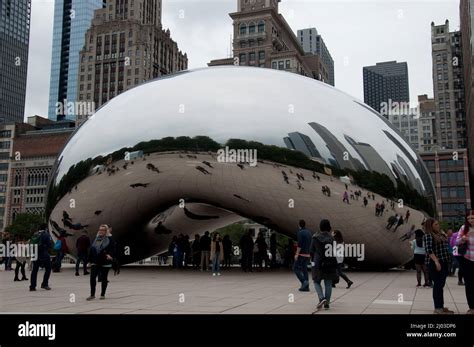 Reflections in The Bean, Chicago, Illinois, USA. This bean attracts huge crowds as it allows ...