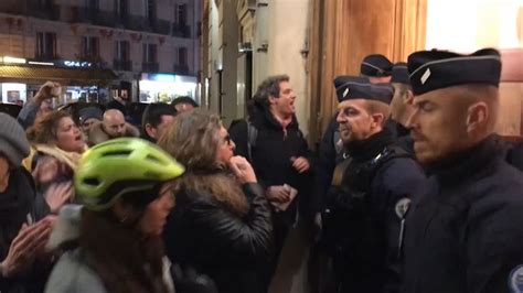 Emmanuel Macron rushed out of Paris theatre after protesters try to ...