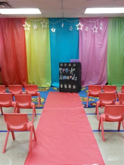 My class decorated for end of year awards. Red carpet and $1 plastic table cloths as a backdrop ...