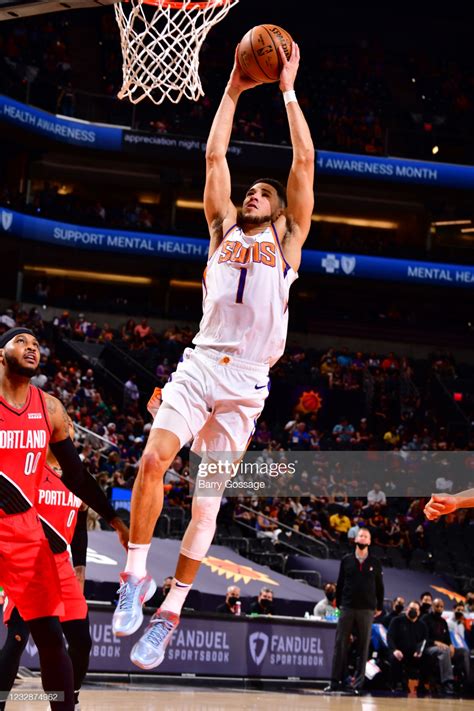 Devin Booker of the Phoenix Suns dunks the ball during the game ...