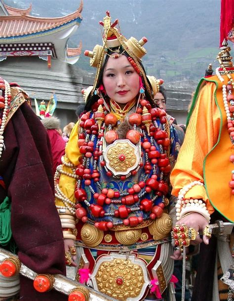 Tibetan woman from Nyarong in exquisite and heavy ceremonial finery from her area. She wears ...