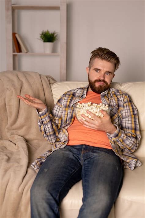 Single Man on the Couch Watching TV Stock Image - Image of relax ...