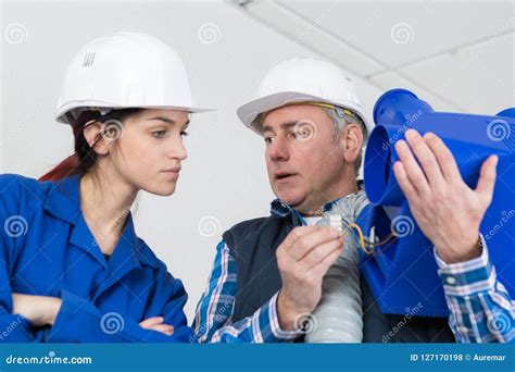 Female Plumber with Apprentice Stock Photo - Image of people, plumbing ...