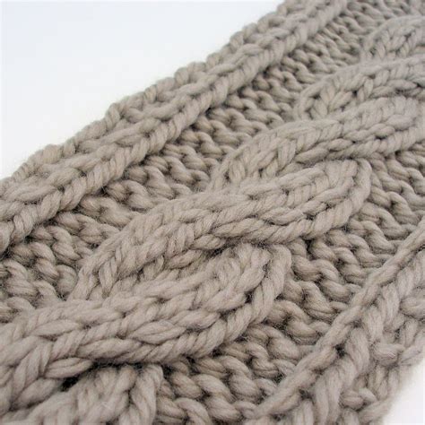 a close up of a knitted object on a white surface